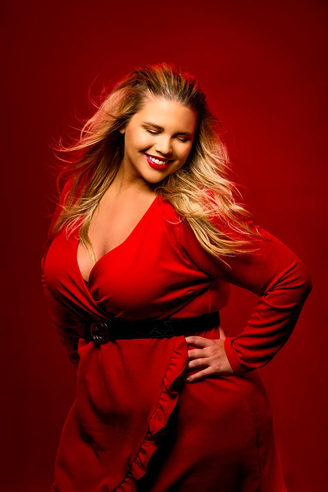 Studio portrait of a fashion model in red dress
