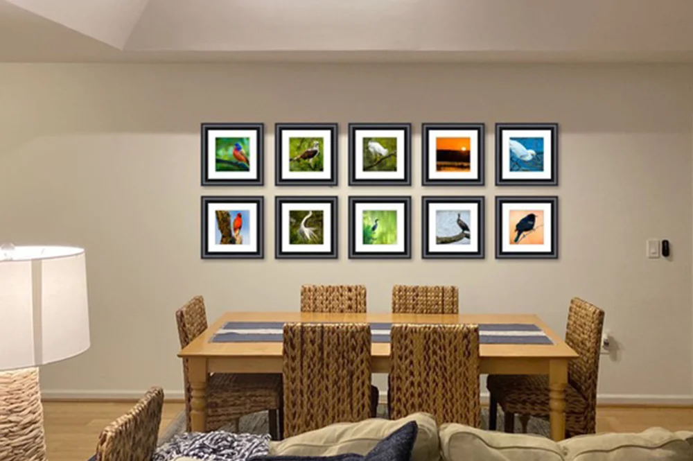 Dining room with two rows of 5 color fine art photography images on wall  