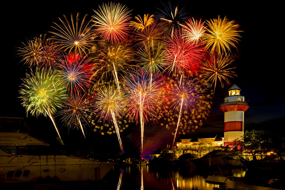 A composite image of fireworks at the Harbour Town lighthouse on the 4th of July