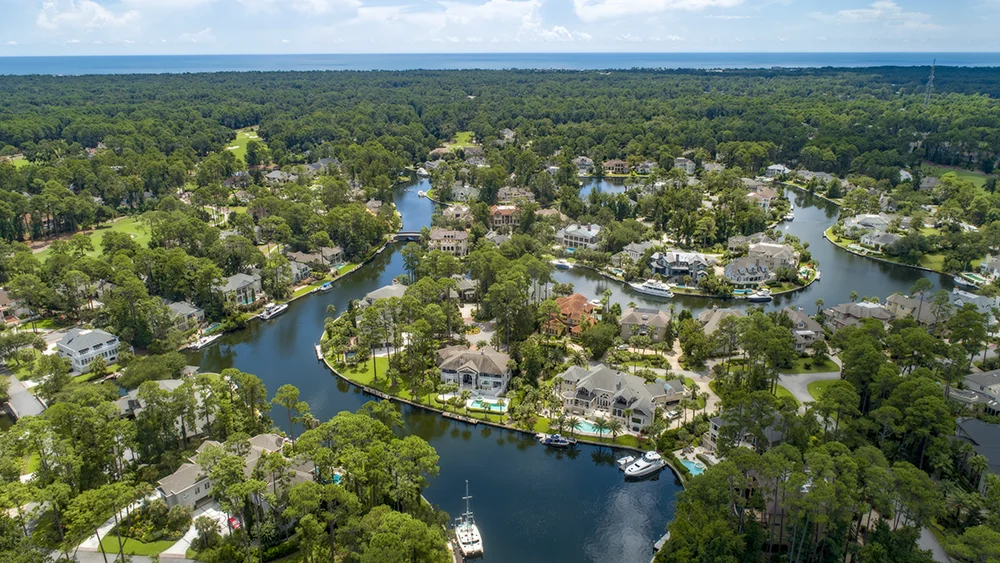 Overhead view of a housing development with various waterways and boat docks